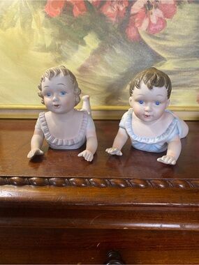 Pair of Bisque Baby Half Dolls in Pale Pink and Blue